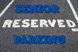 parking spot on asphalt that says reserved